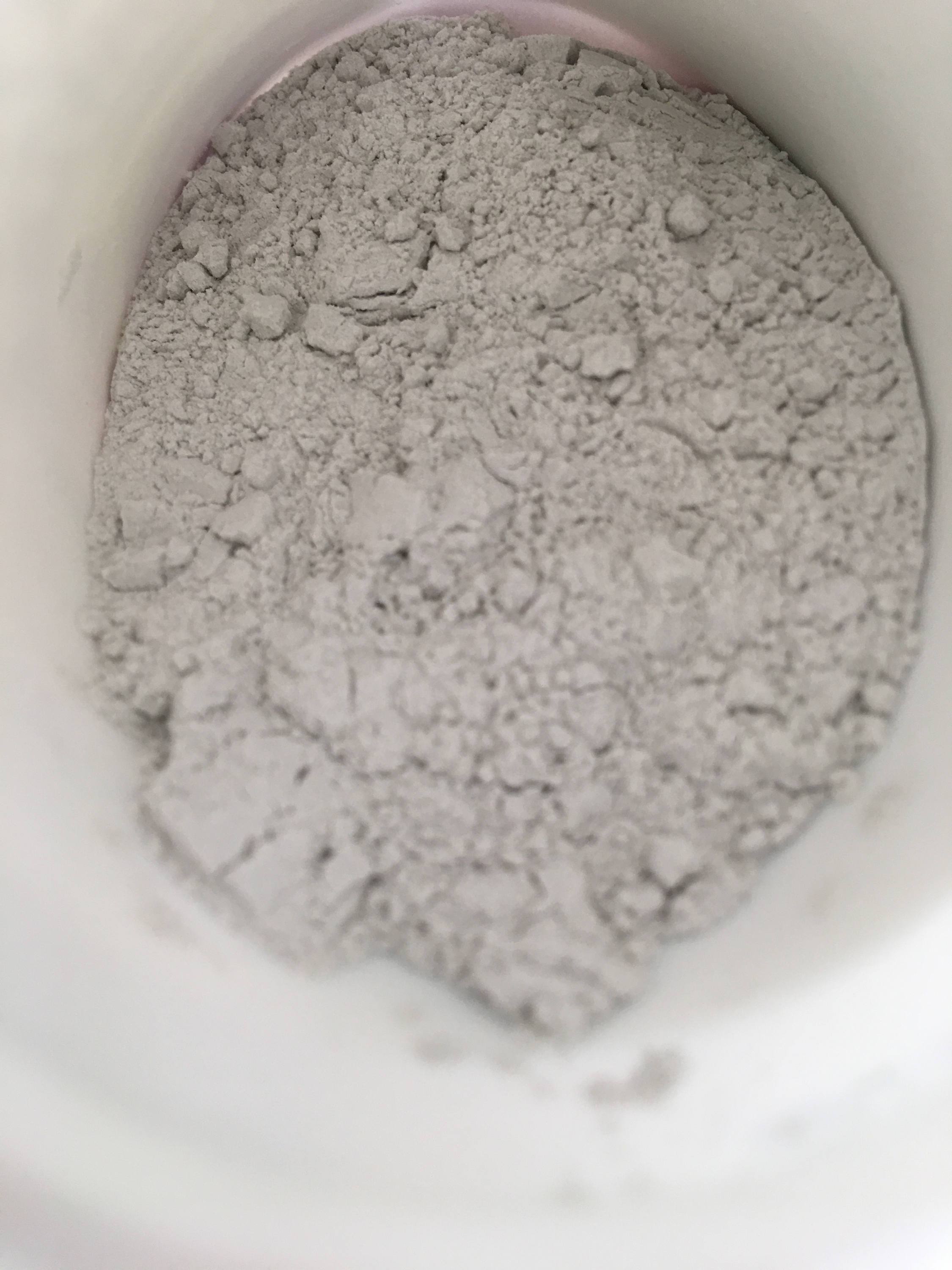 Close-up of pale rooting powder inside a container